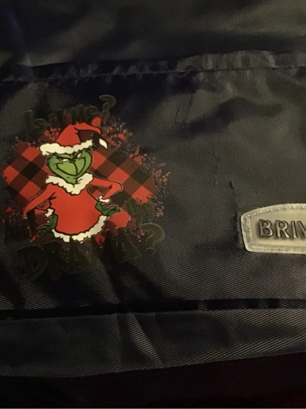 Black insulated lunch bag with Grinch Holiday Graphic